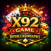 X92 Game casino themed logo with golden text, crown, roulette wheel, playing cards, dice, poker chips, and colorful glowing background